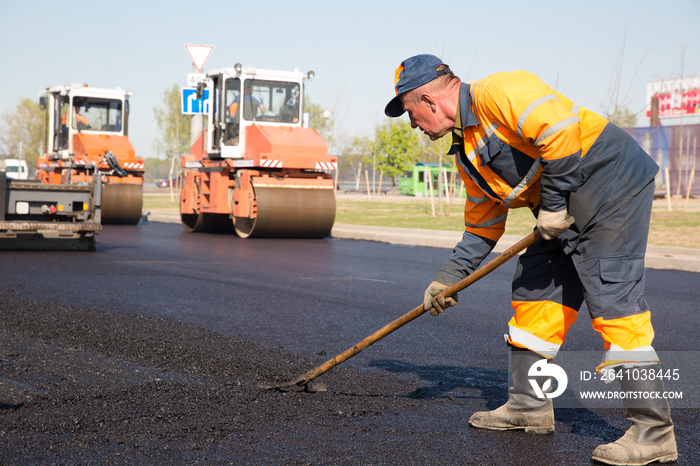 Construction Worker during Asphalting Road Works