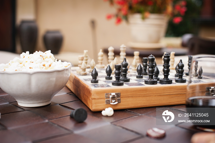 Close-up of cropped chess game against blurred potted plant; Rancho Sante Fe; USA