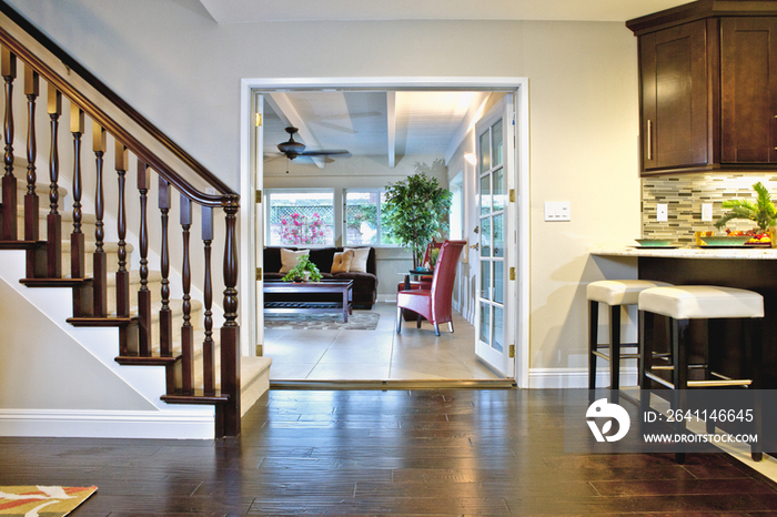 Staircase and living room in two story house; California; United States of America