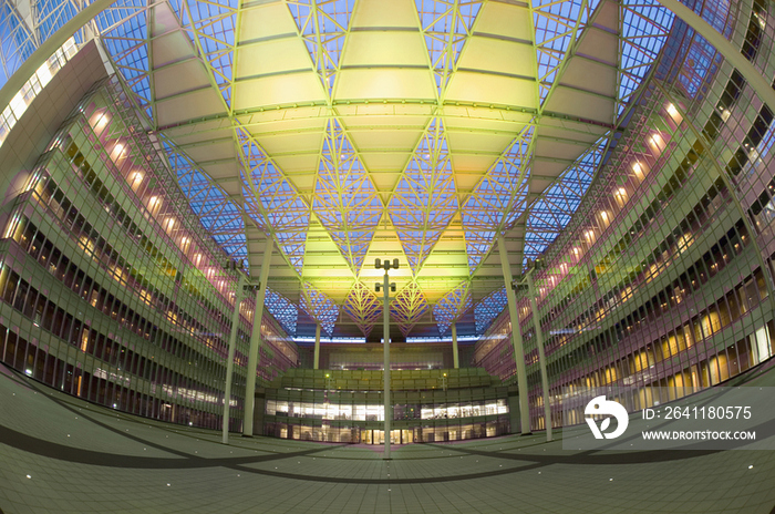 Birds eye view of walkway with columned ceiling in illuminated modern office building