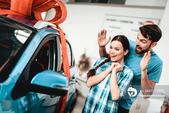 A Guy Presents A Car To Girlfriend. Gift Concept.