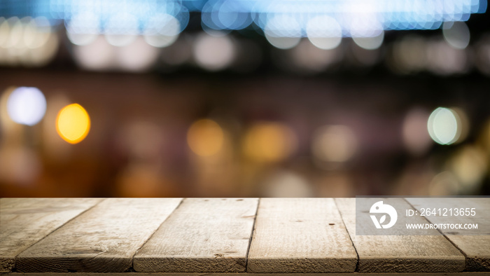 Empty wooden table platform and bokeh at night