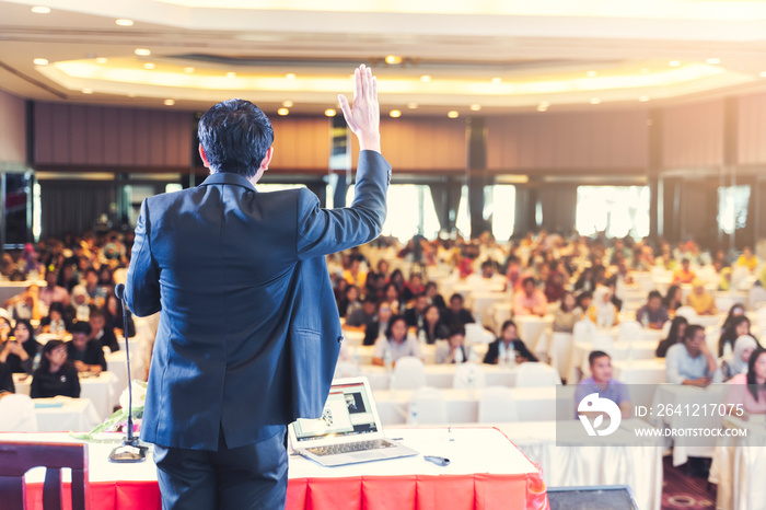 Asian businessman giving speech presentation stage meeting hall conference professional boss chief e