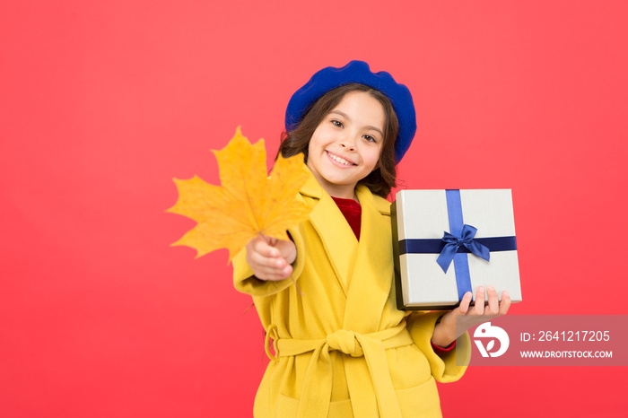 Feeling great. happy small girl with maple leaf and present box. girl child in french beret hold gif