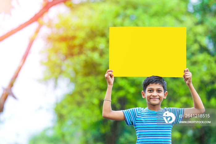 indian child holding empty poster