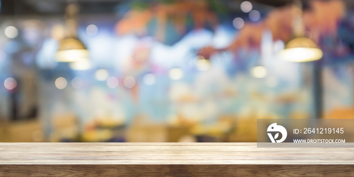 Empty wooden table top with blur coffeeshop window background, Panoramic banner.