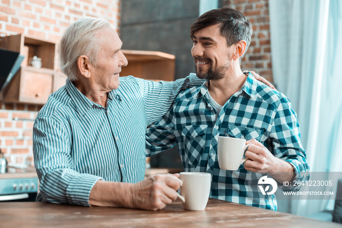 Positive happy father and son spending time together