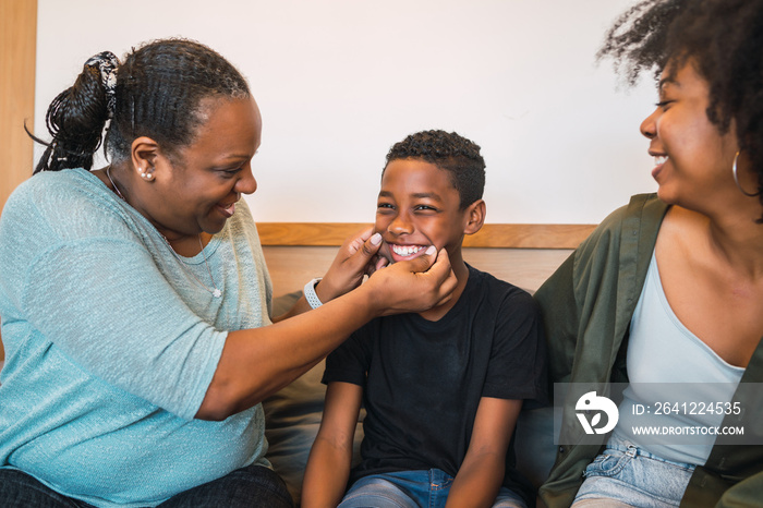 Grandmother, mother and son spending good time together.