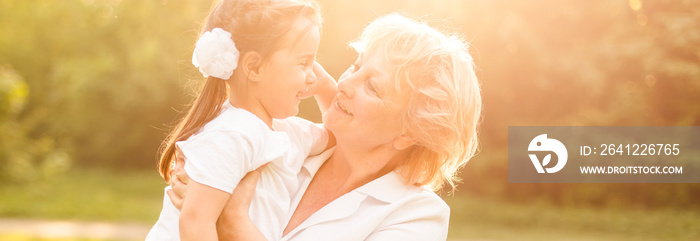 Grandmother with granddaughter in park