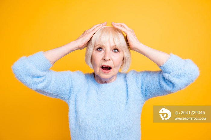 Close up portrait of scared old woman frowning and gesturing emo