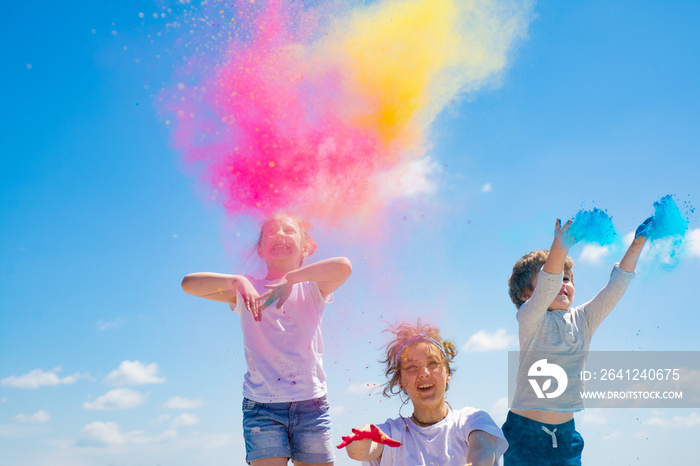 Children painted in the colors of Holi festival.