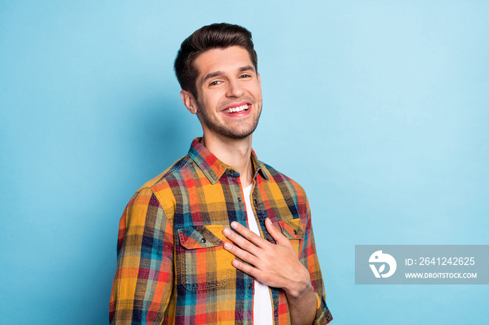 Portrait of attractive cheerful pleased calm guy good mood news isolated over bright blue color back