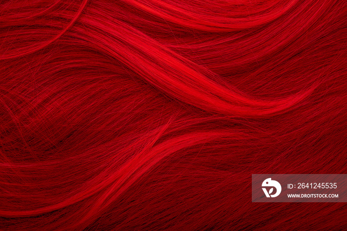 Red hair. Background hair closeup. Female long red-haired close-up as a background. Beautifully laid