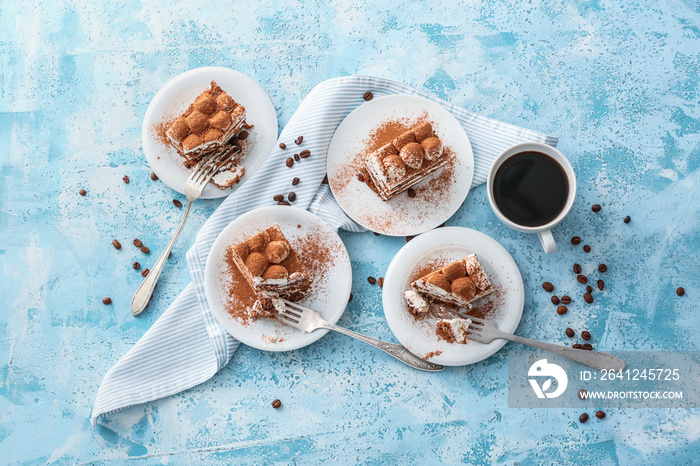 Plates with tasty tiramisu and coffee on color background