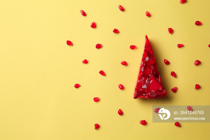 Piece of tasty cake on color background