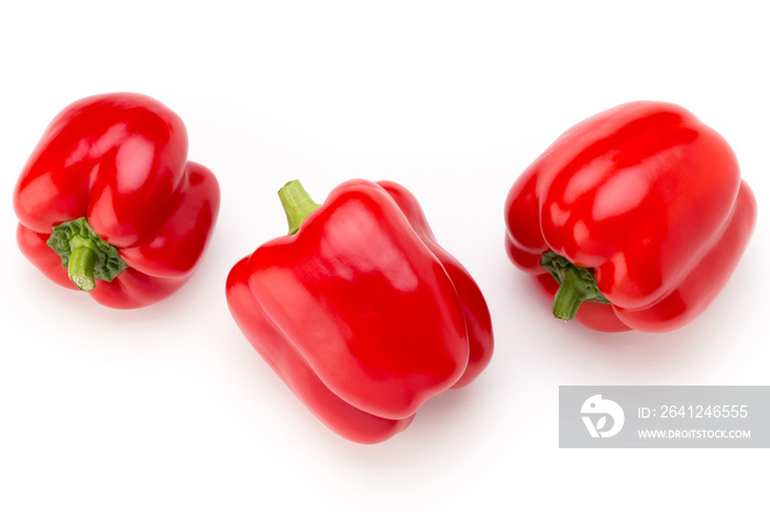 Red bell pepper with half and leaves isolated on white.