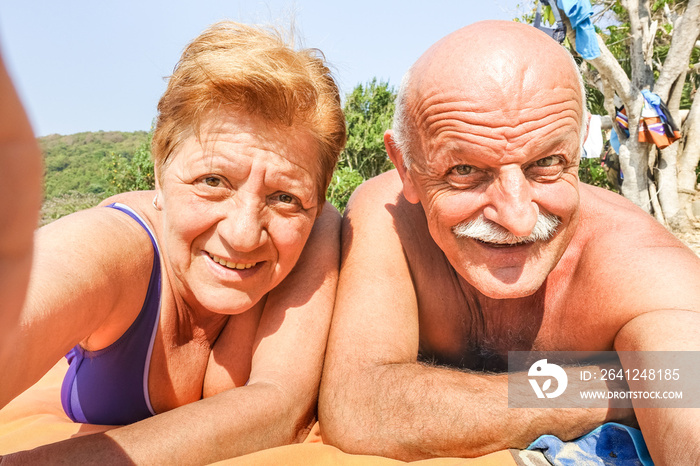 Senior happy couple taking selfie at beach resort in Thailand trip on tropical tour - Adventure and 