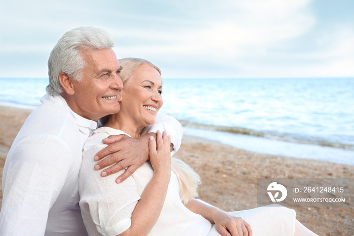 Happy mature couple at sea resort