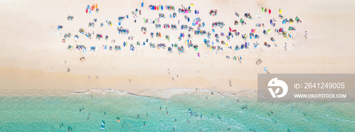 Aerial view crowded public beach with colourful umbrellas, Aerial view of sandy beach with tourists 