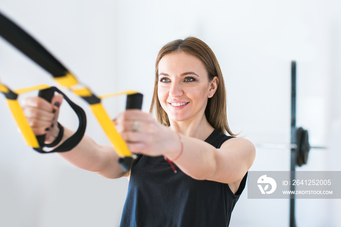 portrait of young woman training at the gym