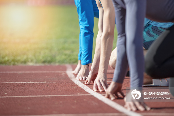 Athletes at the sprint start line in track and field