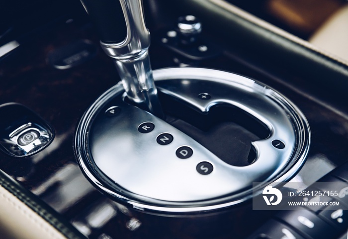 Automatic gearbox shift lever in luxury car.