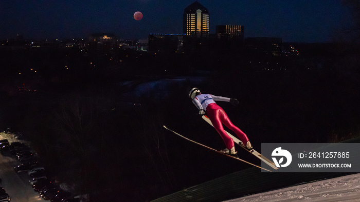 People are doing ski jump under the blood wolf moon