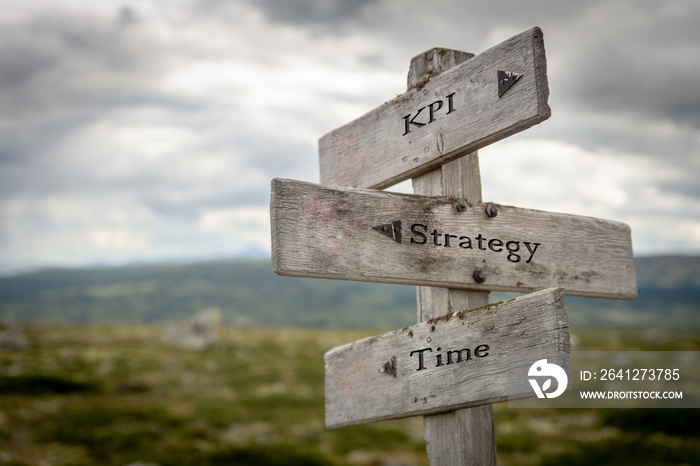 Kpi, strategy and time text on wooden road sign outdoors in nature.