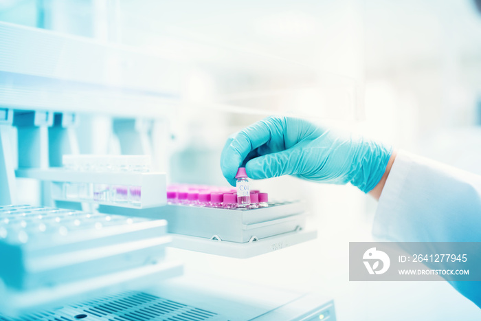 professional scientist holding sample of experiment in pharmaceutical environment. close up of medic