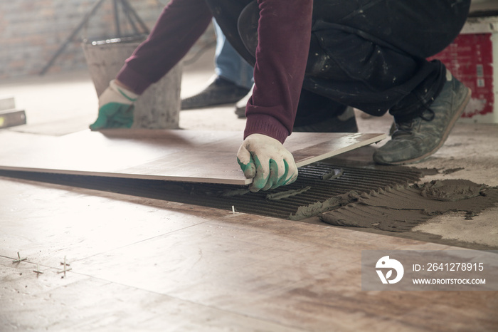 Laying floor ceramic tile. Renovating the floor