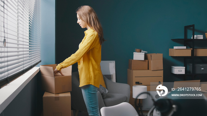 Woman moving in a new house