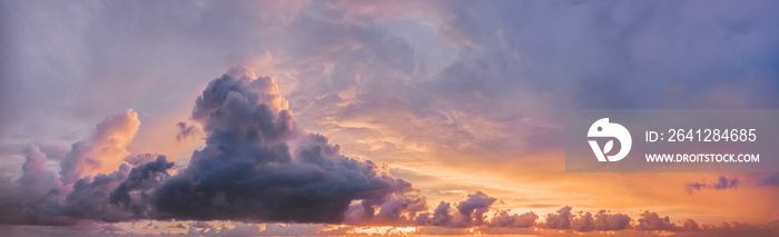 beautiful lilac clouds on the sky panorama and purple orange sunset