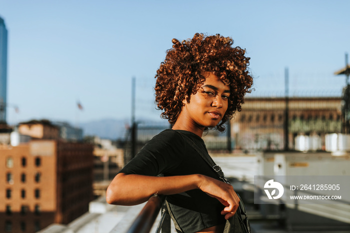 Girl with curly hair at a LA rooftop