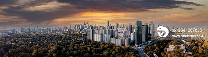 Drone Panorama of Toronto skyline with trees surrounding the cityscape	 sun set time 