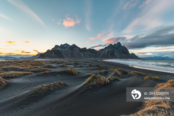 Vestrahorn mountain on Stokksnes cape in Iceland during sunset . One of the most famous travel locat