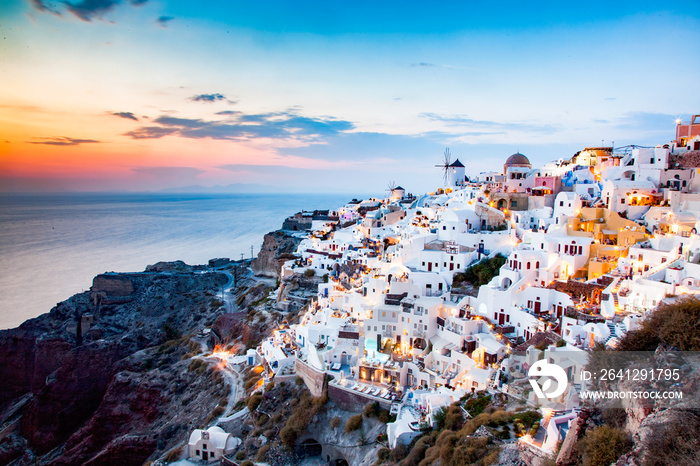 amazing view of Oia town at sunset in Santorini, Cyclades islands Greece - amazing travel destinatio