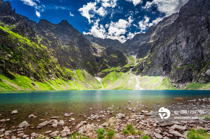 Beautiful pond in the middle of the mountains at dawn