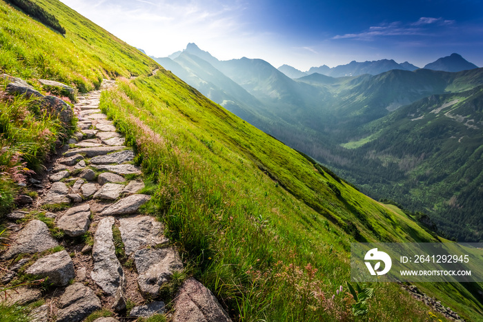 Footpath in the mountains at sunrise