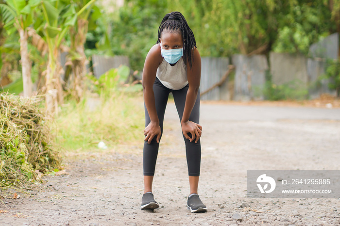 runner girl lifestyle during post quarantine new normal times - young attractive and fit black afro 