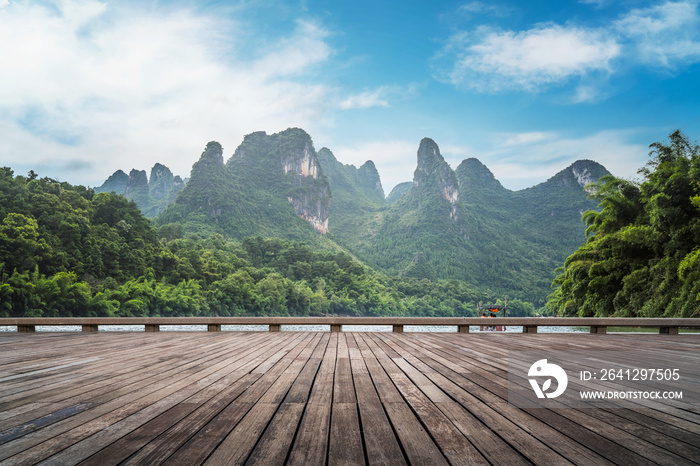 Wooden plank road and green mountains and green water natural landscape