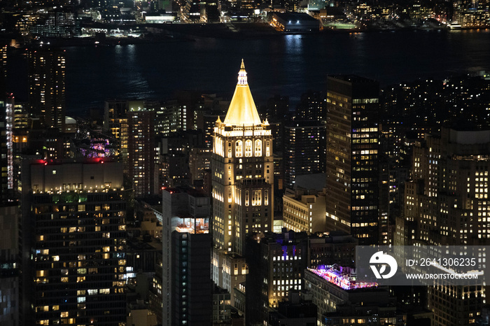 Scenic view of Manhattan life insurance building and downtown skyscrapers at night