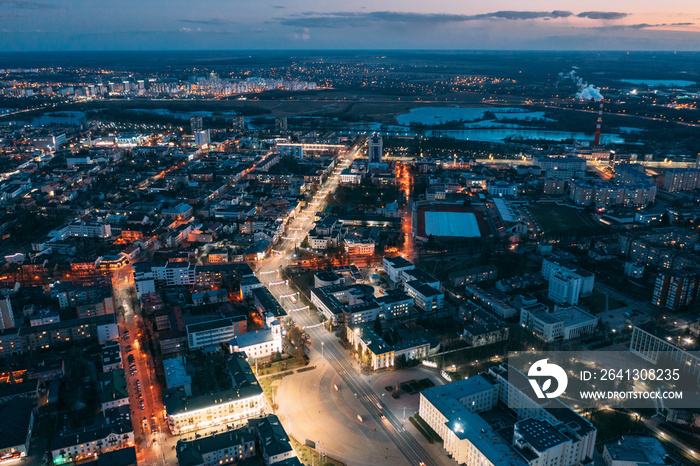 Brest, Belarus. Top View Of Cityscape Skyline City In Evening Illuminations. Night Aerial View Of Le