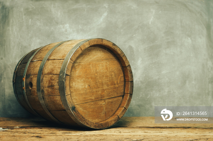 Wooden barrel and worn old table of wood.