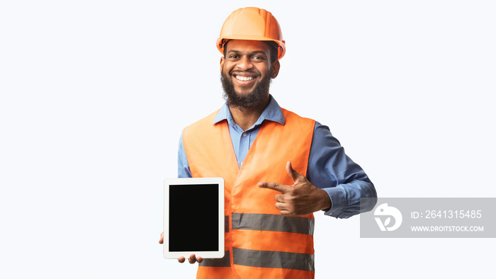 Builder Worker Showing Digital Tablet Empty Screen, Panorama, Studio Shot