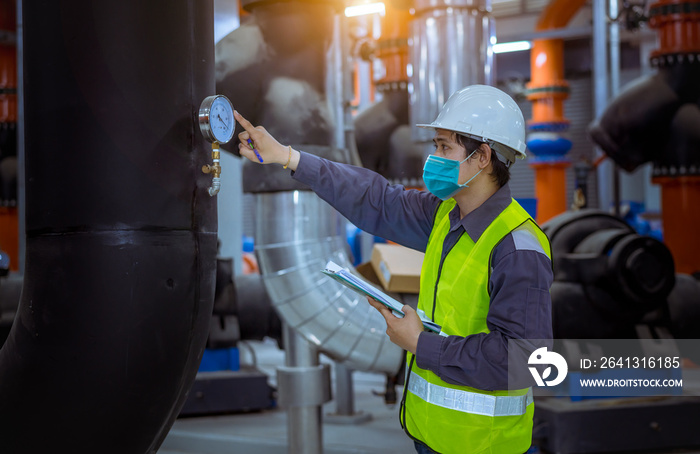 Engineer under checking the industry cooling tower air conditioner is water cooling tower air chille