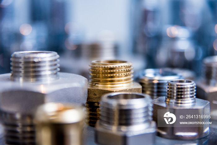 Hosepipe fittings on the table. Plumbing pipeline spare parts.