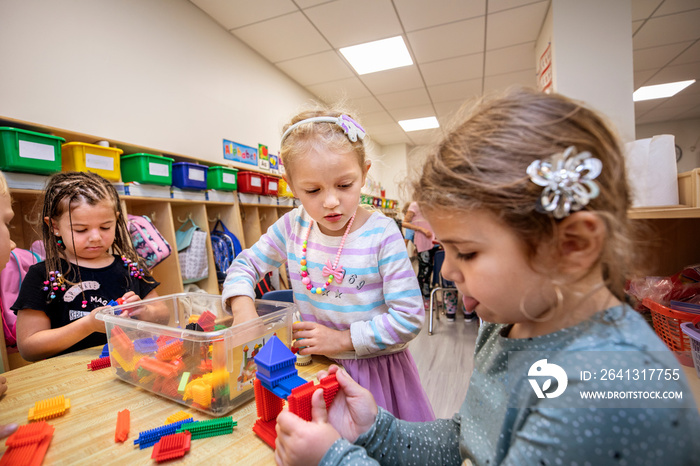 Children playing with puzzle pieces