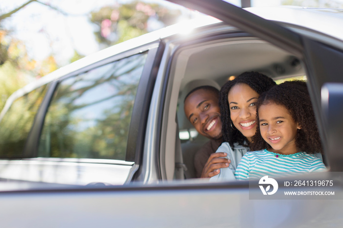 Portrait happy family inside car