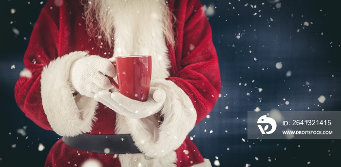 Composite image of santa holds a red cup