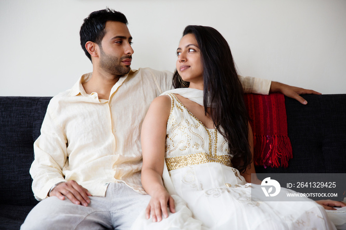 Couple sitting on sofa